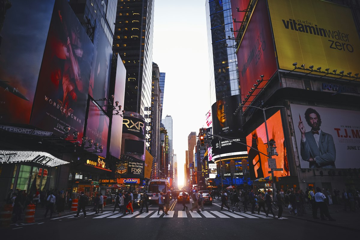 Busy avenue in New York City at sunset